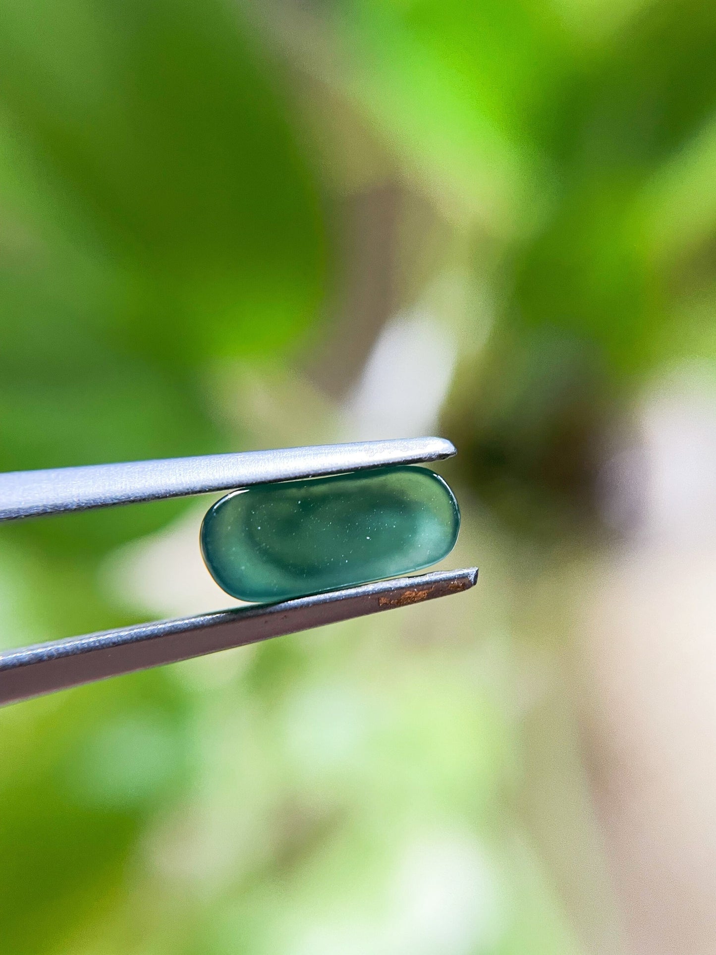 Green Jadeite Carved Saddle Cut Gemstone