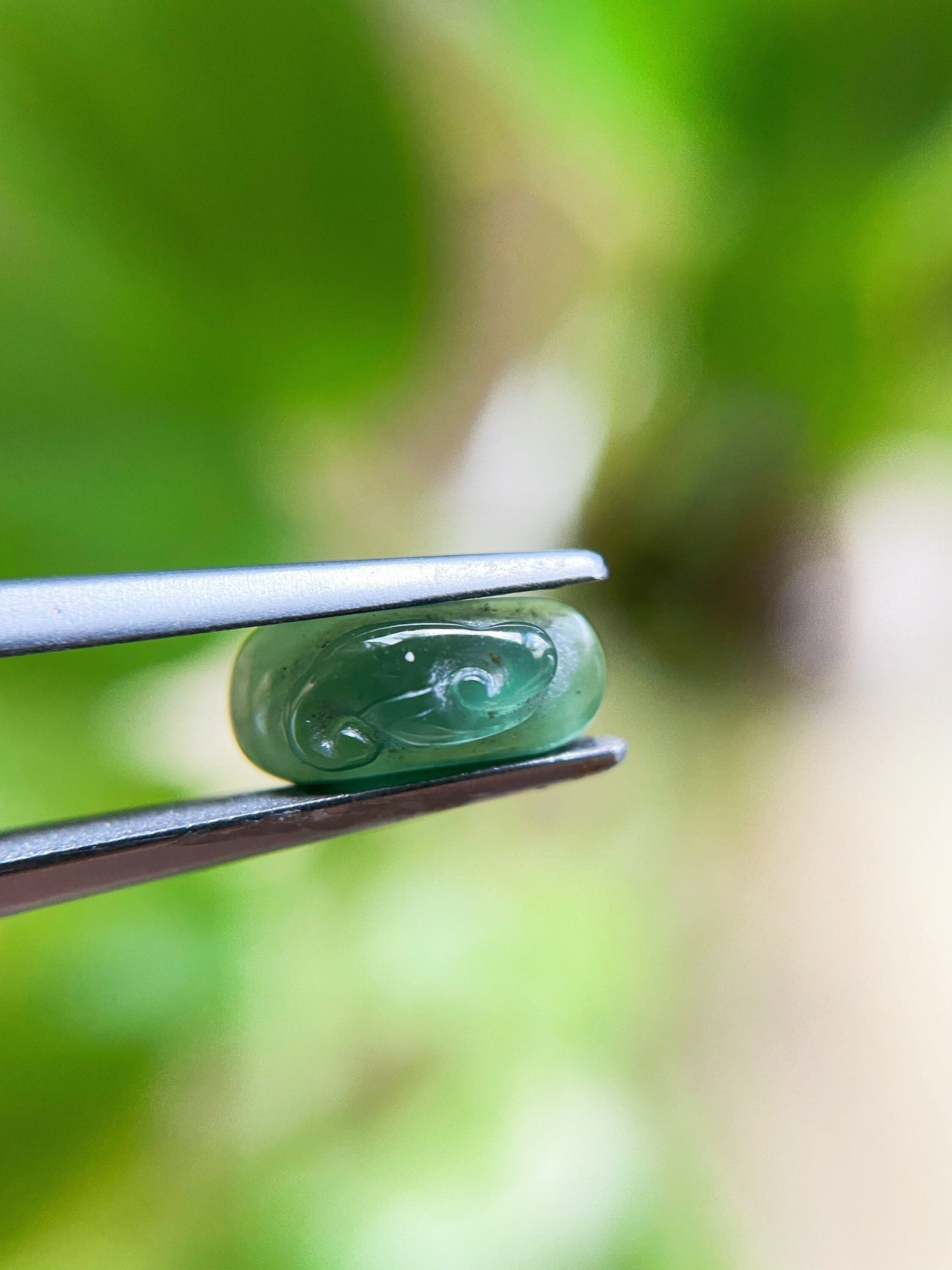 Green Jadeite Carved Saddle Cut Gemstone