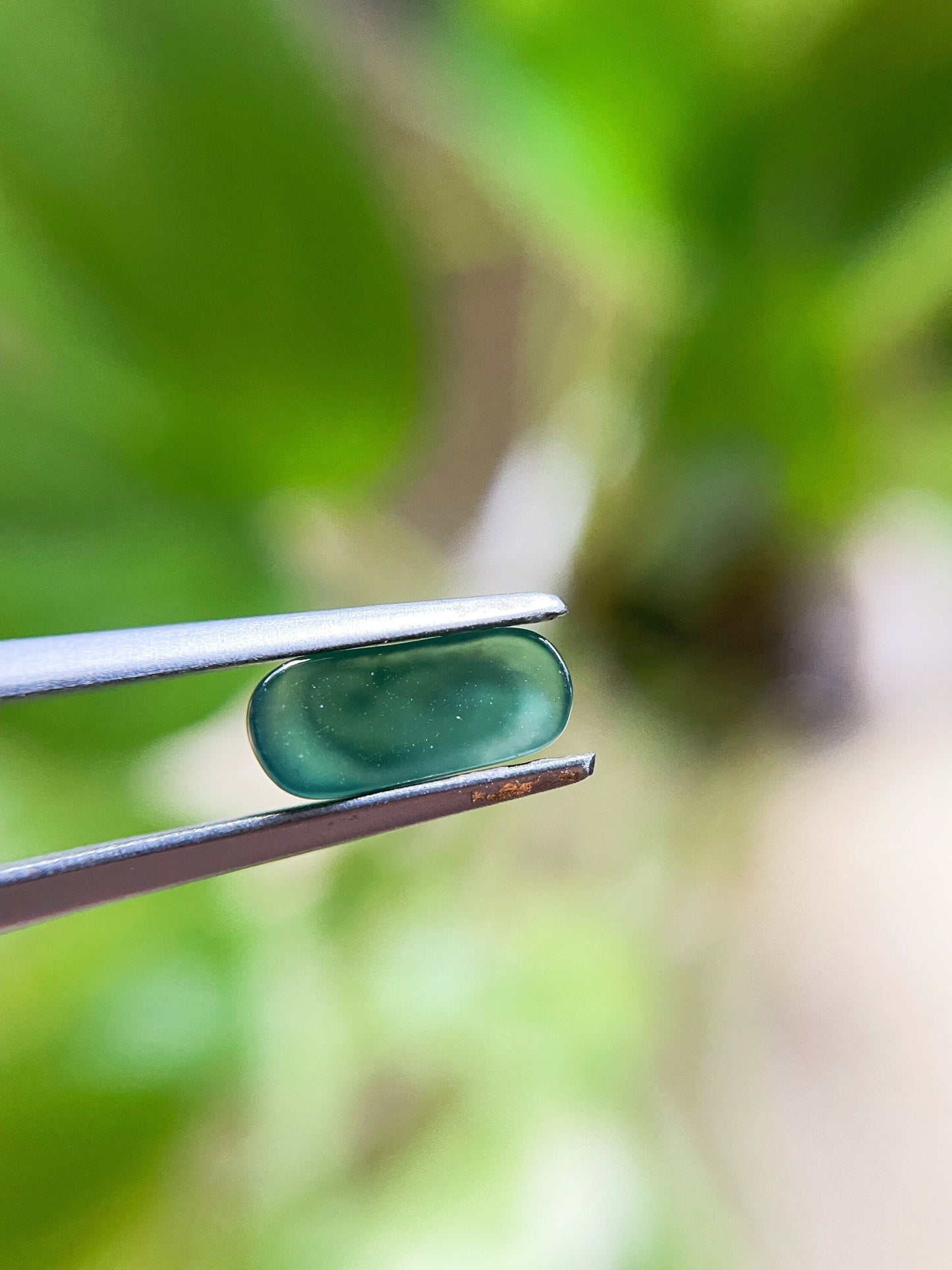 Green Jadeite Carved Saddle Cut Gemstone