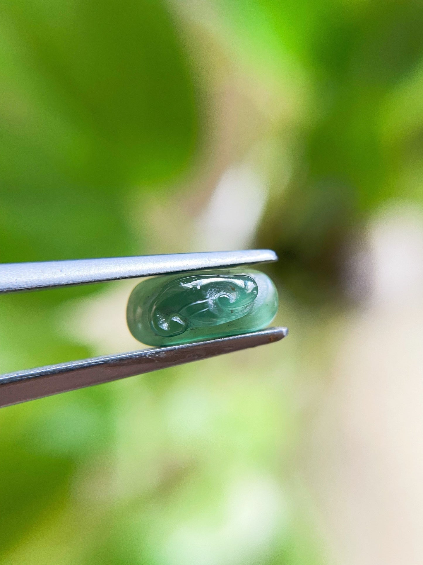 Green Jadeite Carved Saddle Cut Gemstone